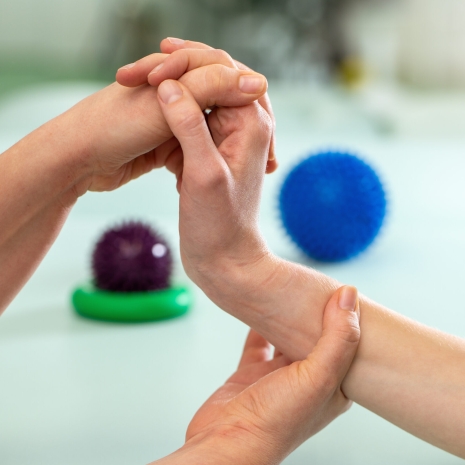 Doctor exercising and making rehabilitation with patient wrist